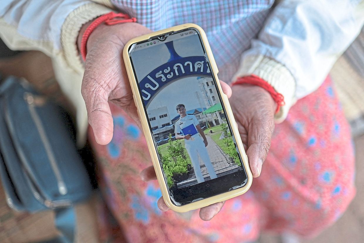 With her friend Laaiad Namneewong at her home in Ban Sai village, Surin province. — Reuters