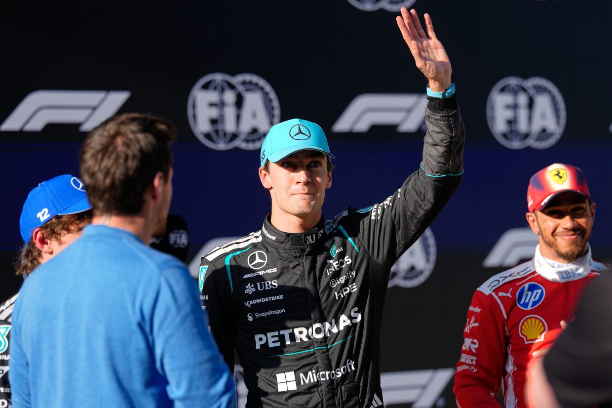Mercedes driver George Russell of Britain waves after the qualifying session of the Chinese Formula One Grand Prix at the Shanghai International Circuit, in Shanghai, China, Saturday, March 14, 2026. -- AP Photo/Andy Wong