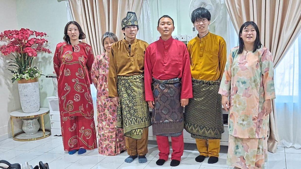 Basir says the guests feel at home during Hari Raya when they put on the baju Melayu and baju kurung. — Photos: Basir Wagiman