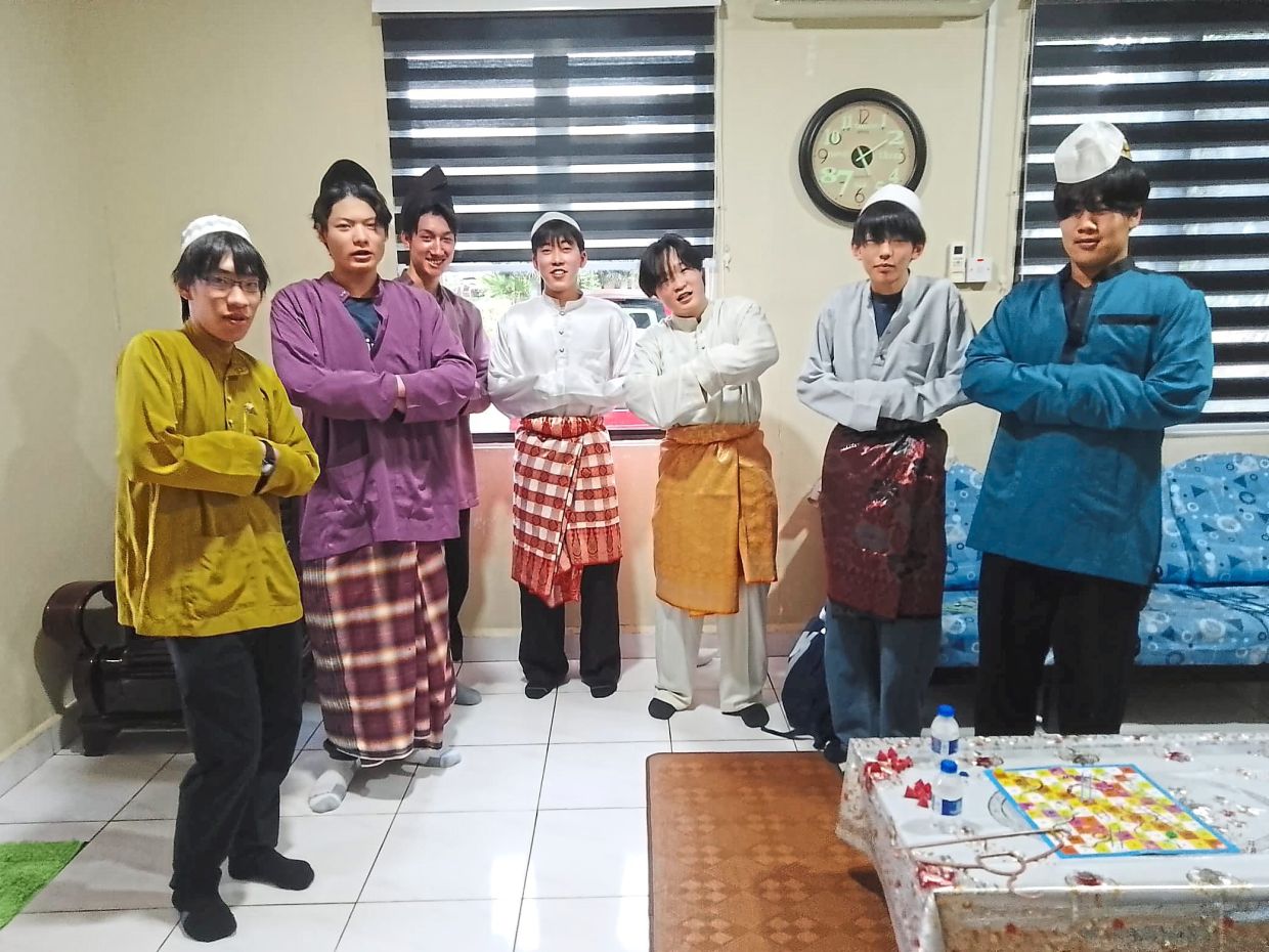 The kampung boys: Homestay guests during Hari Raya are always ready to take part in community activities.