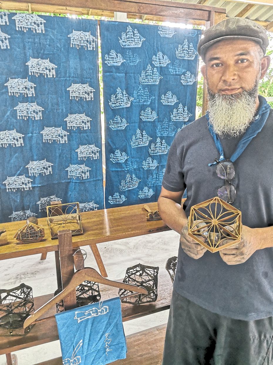 In Pattani, Emsophian has revived the age-old craft of indigo batik, keeping the tradition alive through the use of hand-carved bamboo printing blocks. Photo: Alan Teh Leam Seng 