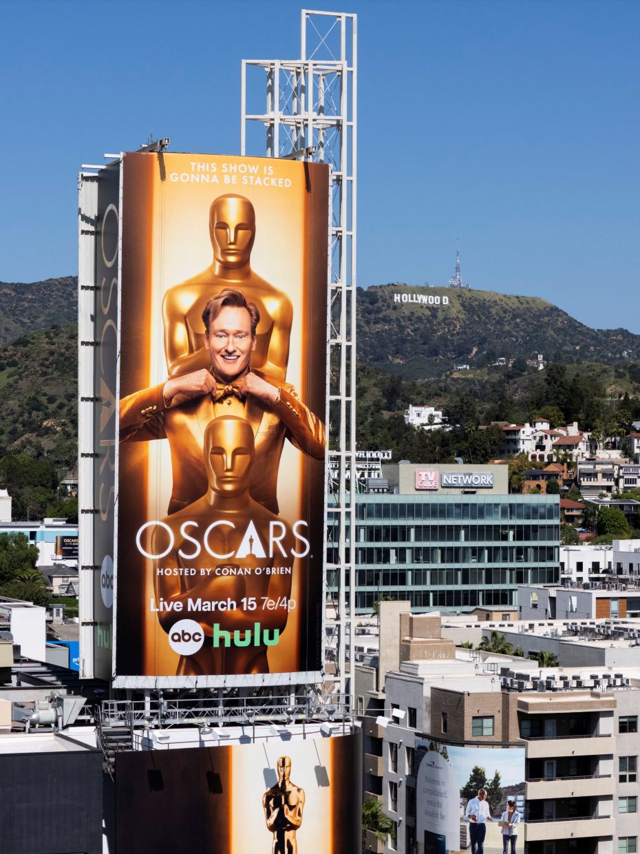 A drone view shows a large billboard sign featuring this year's Oscar host Conan O'Brien towering over Hollywood Blvd. Photo: Reuters