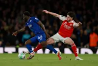 Soccer-Dowman makes history as Arsenal stretch Premier League lead with 2-0 win