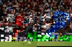 Soccer-Dowman makes history to seal vital Arsenal win over Everton