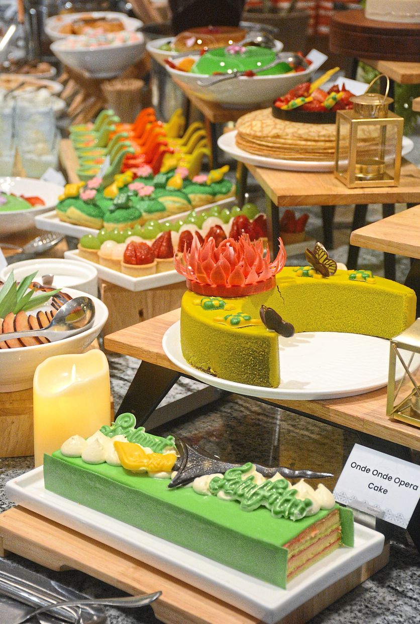 The dessert selection offers a vibrant and varied mix of ‘kuih’, cakes, puddings and more. 