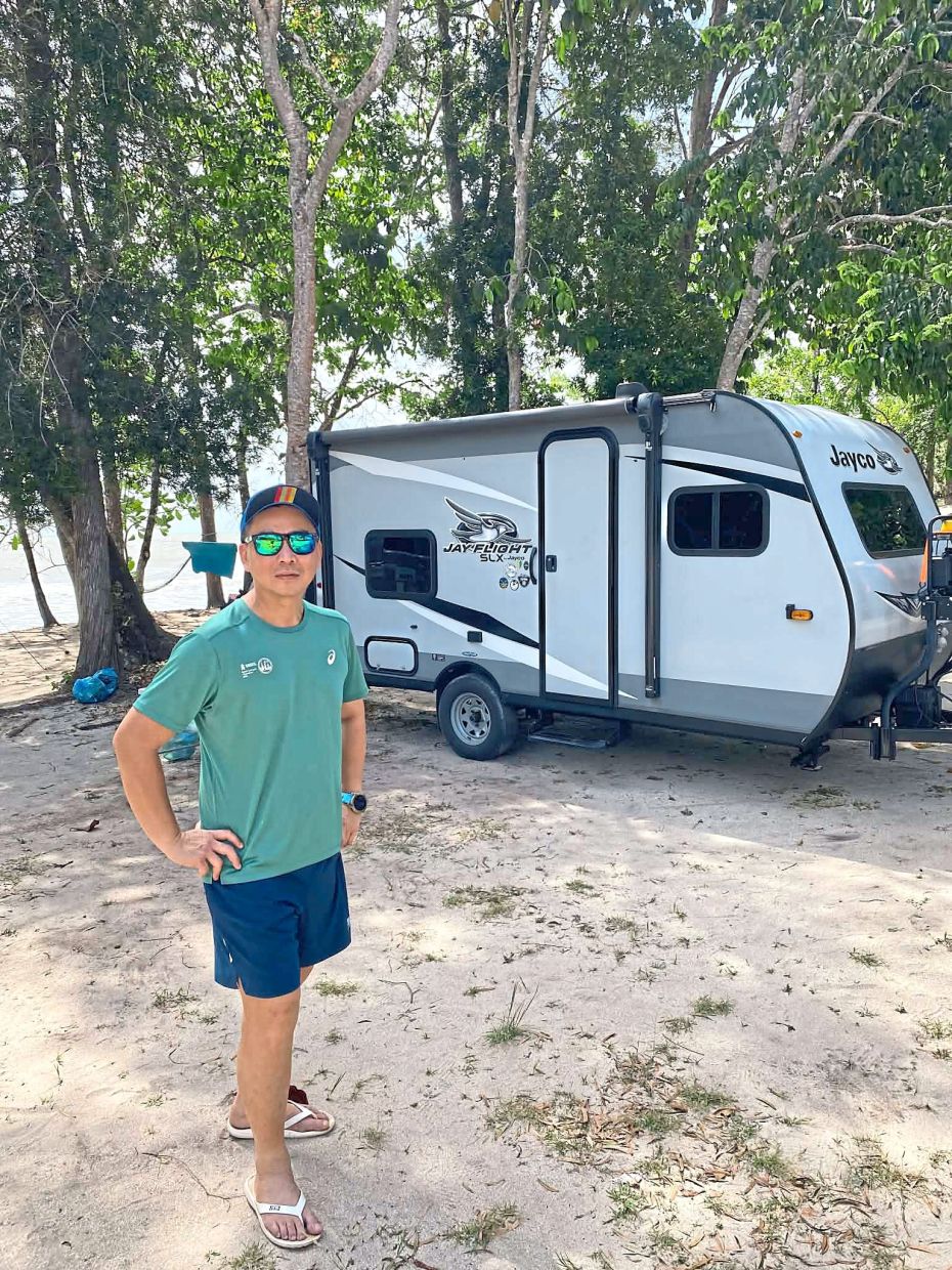 Lew has his own campervan and a caravan (pictured here). — JOHNFY LEW