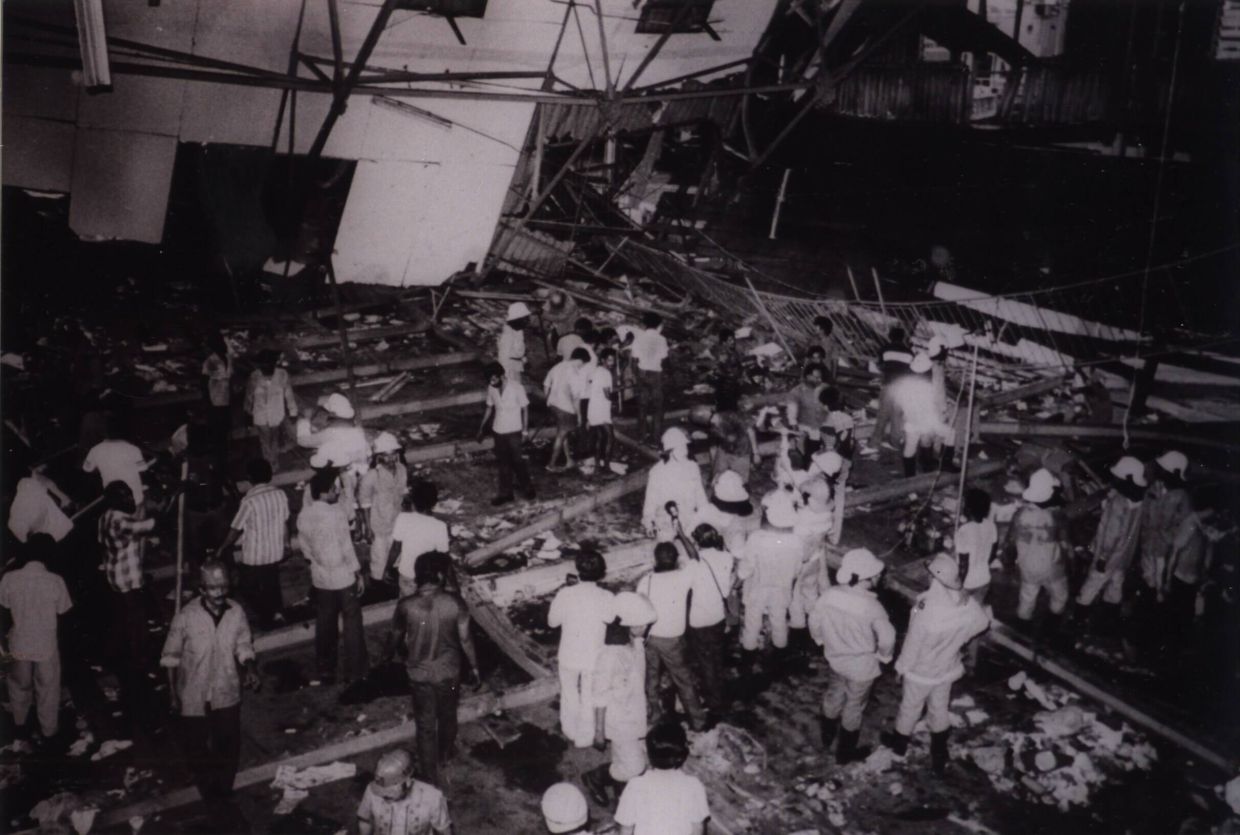 Workers inspecting the site after the tragedy — The Star