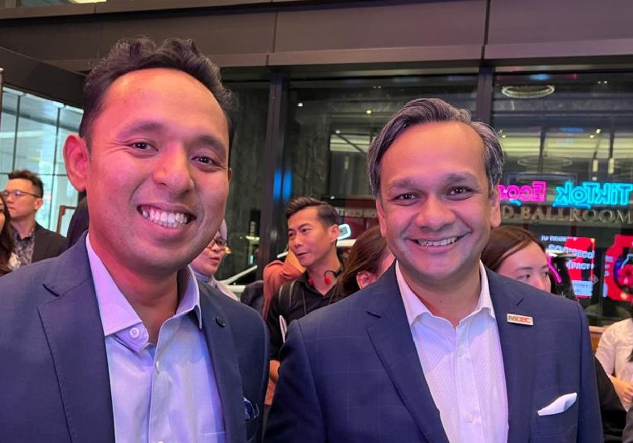 (From left) Tik Tok South-East Asia public policy head Tengku Azrul, with Anuar.