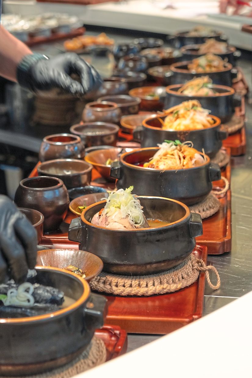 At Modu, the samgyetang is made using chicken bones brewed for 12 hours and a spring chicken cooked with ginseng and jujubes for two hours. — Modu