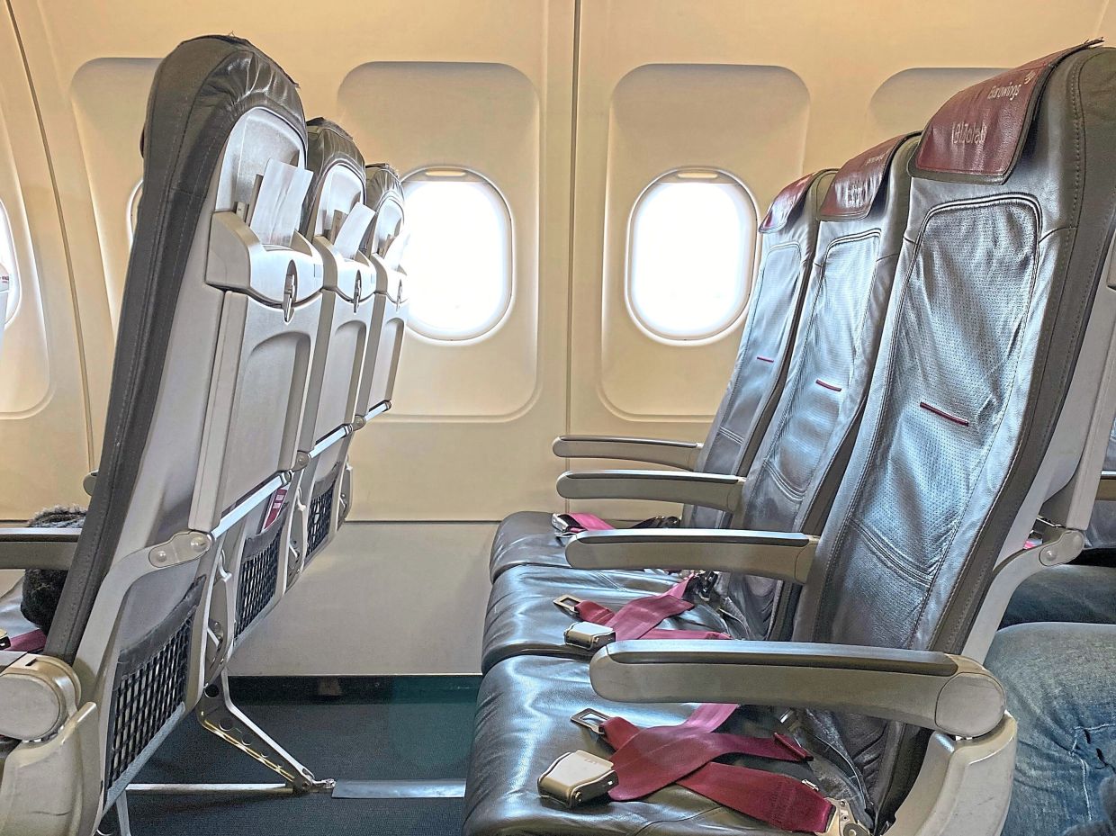 The middle seat is typically not coveted by passengers. — Unsplash