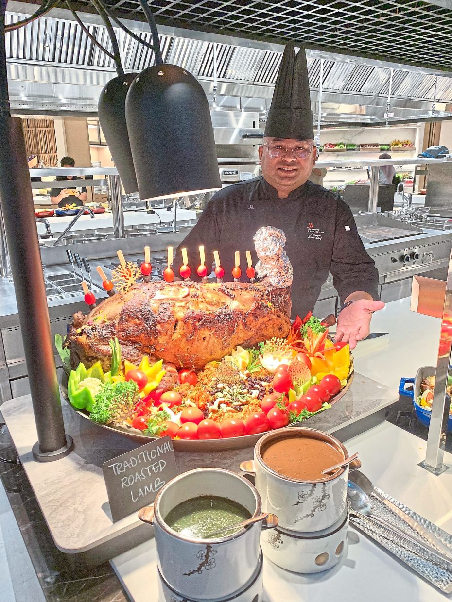 Dennie presenting his Roasted Lamb Stuffed with Briyani at Petaling Jaya Marriott Hotel.