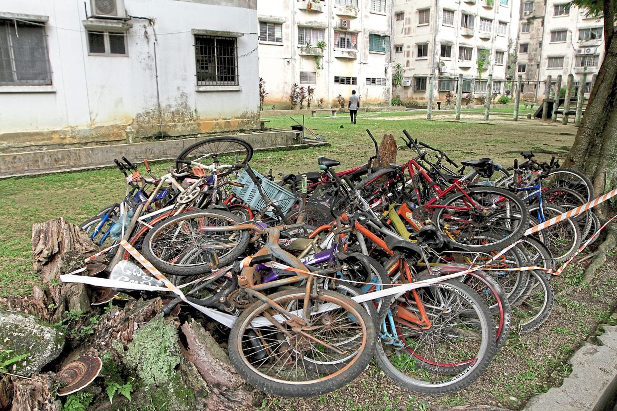 A pile of discarded bicycles at Taman Sri Murni Flats belonging to tenants who have left.