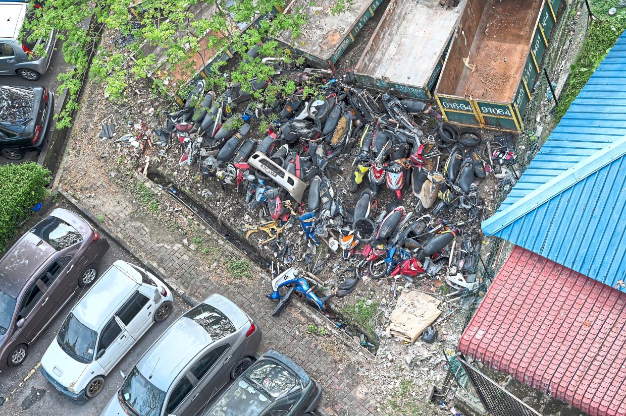 Motorbike junkyards plague KL flats
