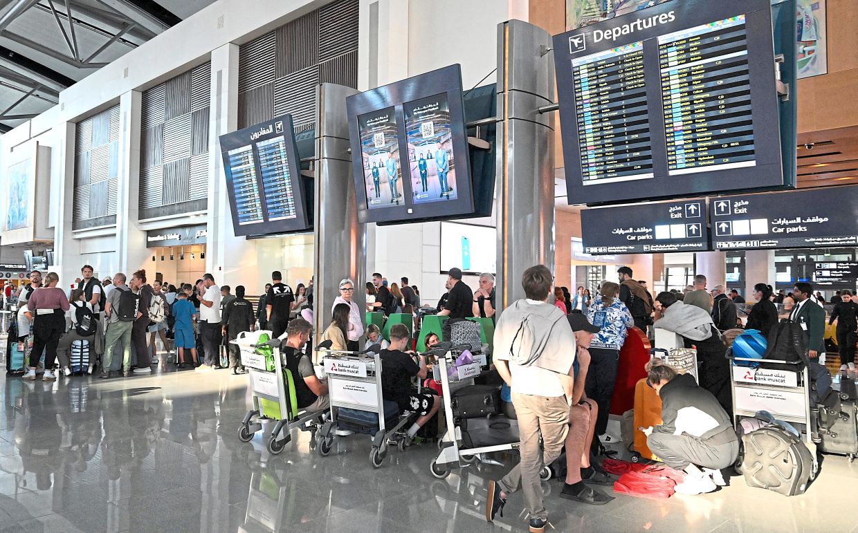 Passengers at the Muscat International Airport in Oman waiting to rebook their flights on March 5. — Oman News Agency/Reuters