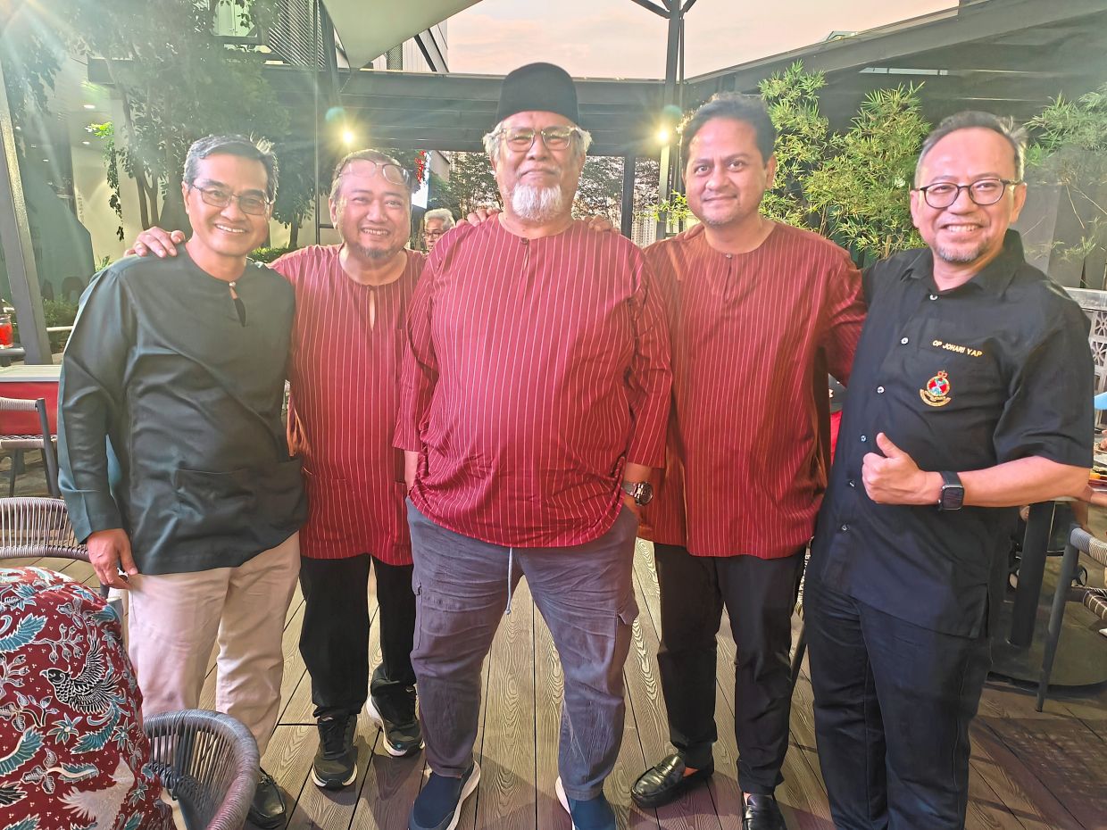 The writer (second from right) with fellow Old Puteras (from left) OP Zulkhibri Mohammad, OP Rozaidie Mustaffa, OP Khairil Kassim, and OP Johari Yap during the Chinese New Year and Iftar gathering, reflecting the camaraderie that continues long after their days at the Royal Military College.