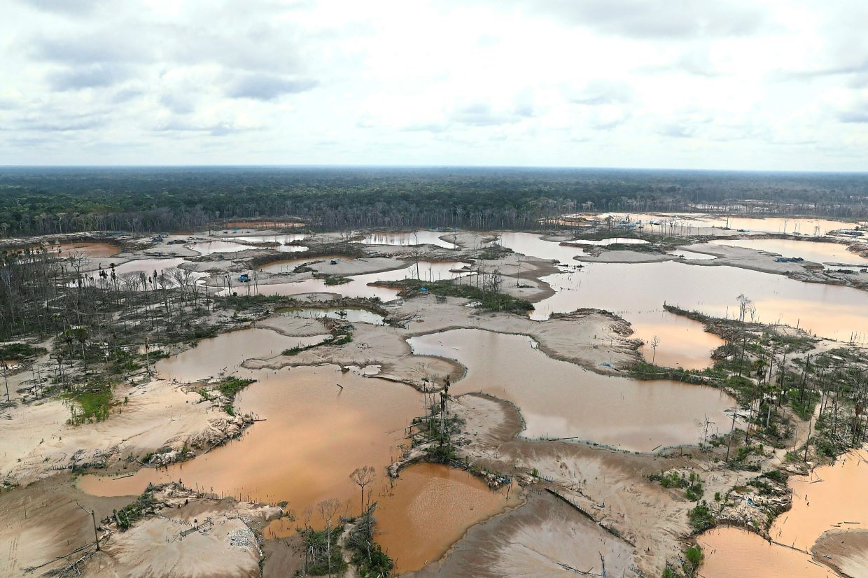 Peruvian jungle devastated by gold miners is visible in Madre de Dios, Peru.