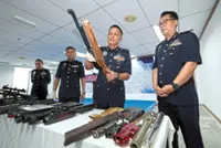 Six airguns and one pistol seized in raid