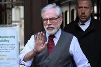 Northern Ireland's Adams tells UK court he was never in IRA in civil trial over bombings