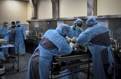 Forensics team cutting a body open during a post-mortem at Universiti Malaya Medical Centre\'s forensic department on 15 January,2026. — AZHAR MAHFOF/The Star