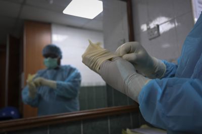 A forensics team preparing for a post-mortem at Universiti Malaya Medical Centre\'s forensic department on 15 January,2026. — AZHAR MAHFOF/The Star