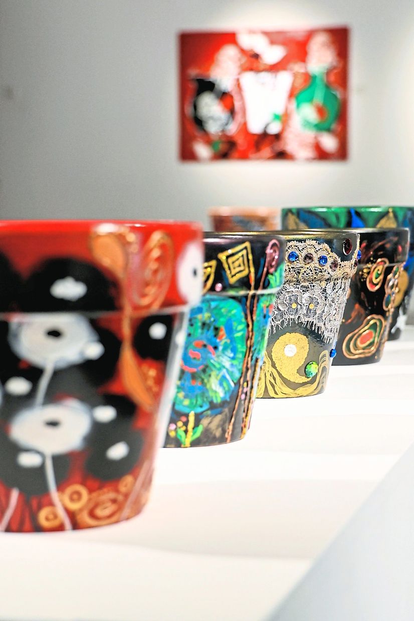 Aside from paintings and poetry, Noura turns terracotta pots into decorative pieces.