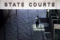 Man charged with harbouring 10 women for prostitution, absconding from Singapore