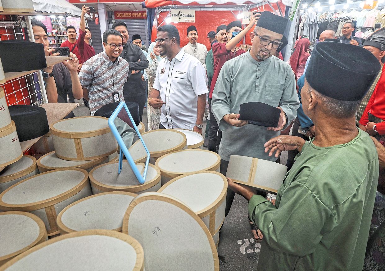 ‘Bazar Aidilfitri Jalan Taiping’ features stalls selling customary items such as ‘songkok’.
