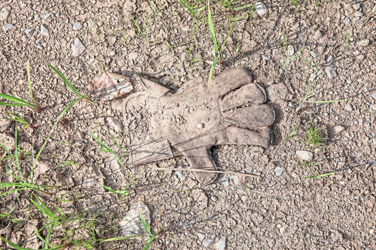A work glove left behind in dried mud in a New York field. Immigrants are more willing to do the dirty, dangerous and demanding jobs most Americans won’t even consider. — Damon Winter/The New York Times