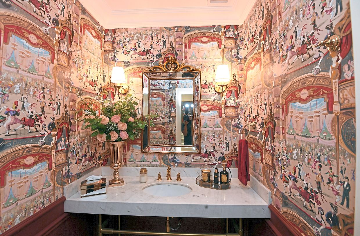 A popular selfie spot for visitors, the powder room is done up in French Renaissance style.