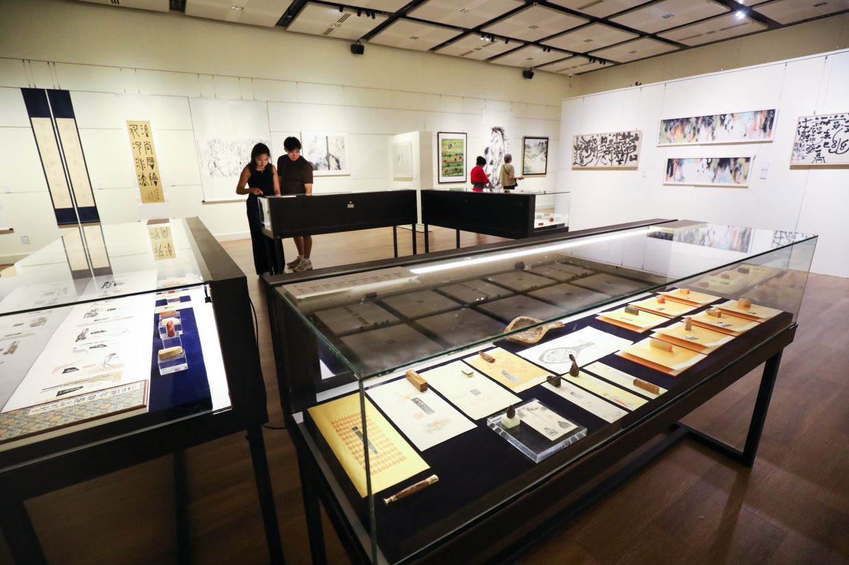 A view of 'Nanyang New Frontiers', currently presented across three floors of the Wisma Kebudayaan SGM, with each level showcasing a rich array of expressive ink works. Photo: The Star/Leong Wai Yee 