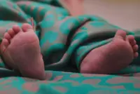 Death of baby at hospital childcare centre, worker charged with murder