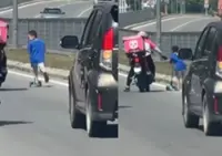 QuickCheck: Did a young boy ride his scooter on a highway in Kota Kinabalu?