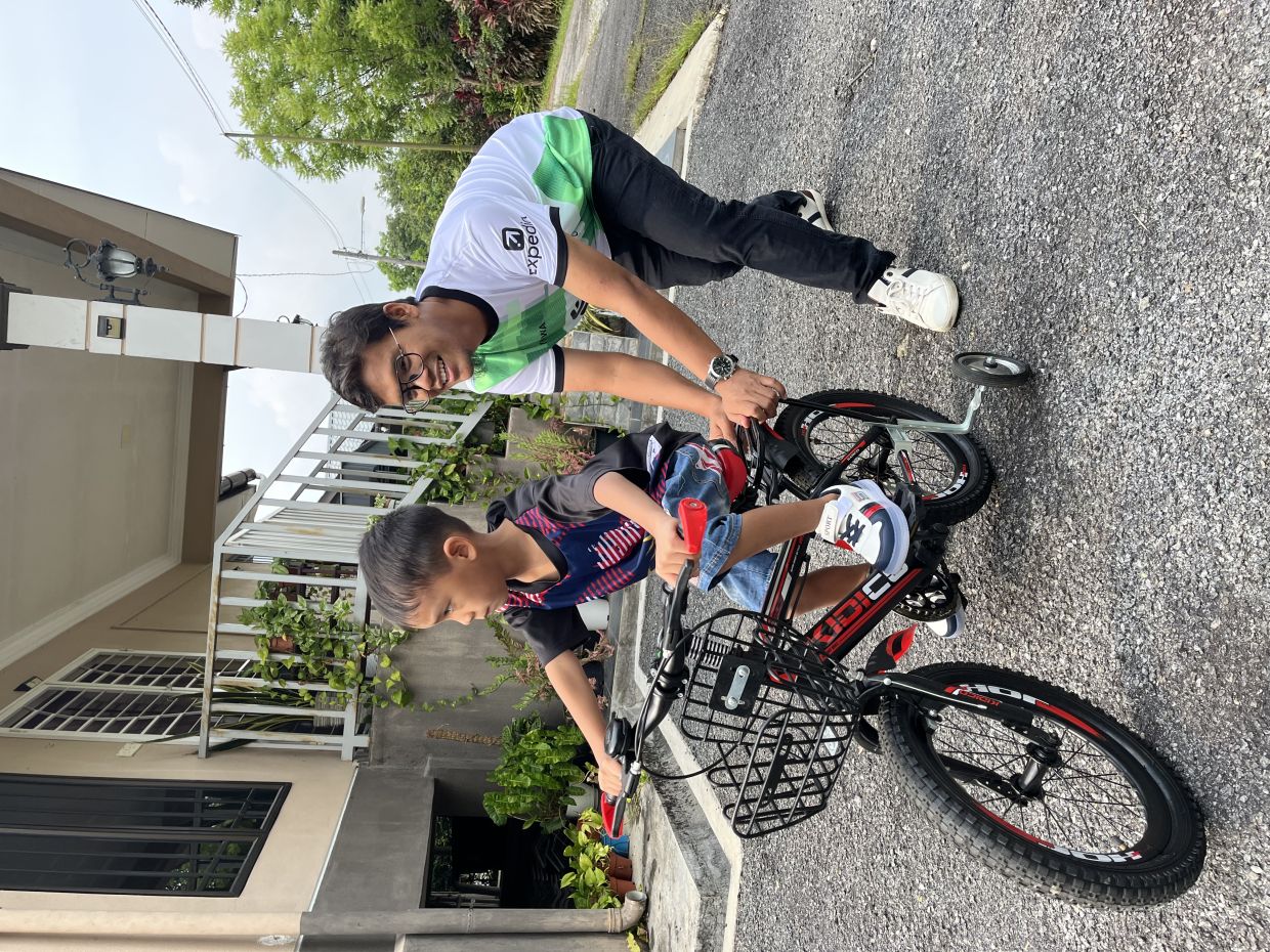 Although previously not much of an exerciser, Dr Mohd Usman tries to do more physical activity these days to stay healthy. Here he is playing with his son.