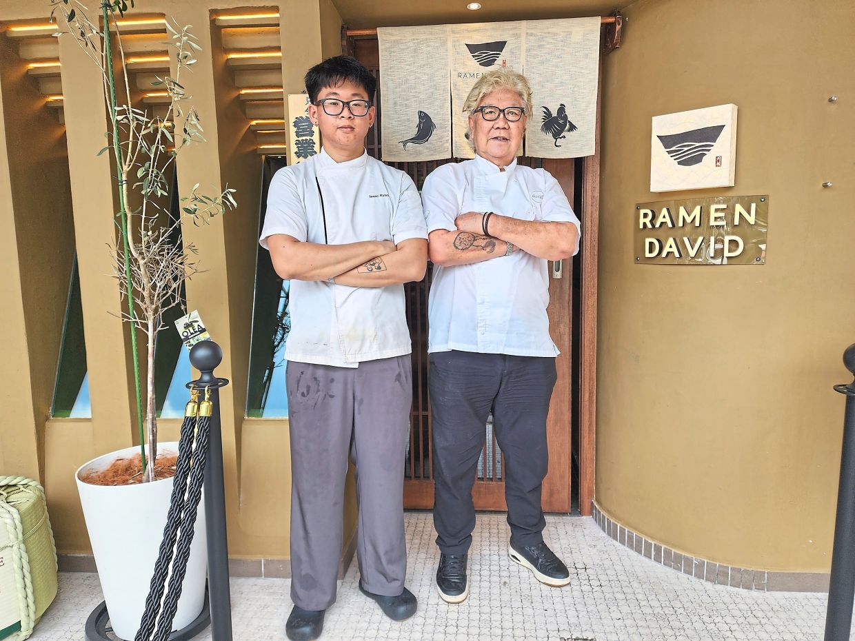 Chin (right) is finally realising a long-held dream to open a ramen restaurant in KL. On his left is senior chef Isaac Ryan Ung. — ABIRAMI DURAI/The Star