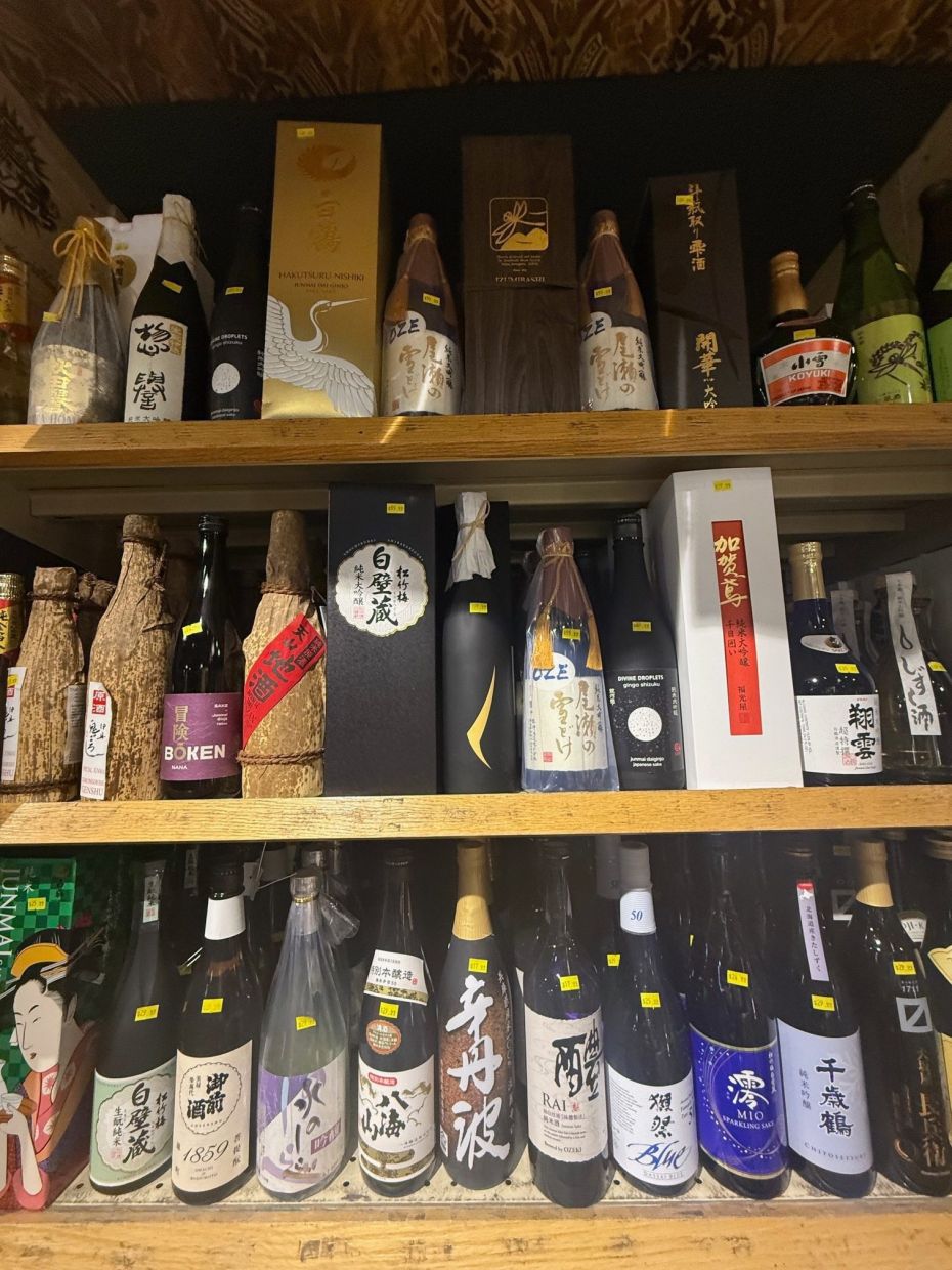 A variety of sake are displayed at Mr. Wright's wine store in New York in March 2026. — Katie Workman via AP
