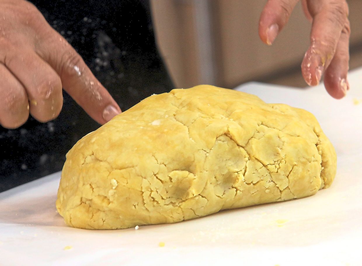 Combine butter, icing sugar, egg, vanilla, milk powder and flour and gently knead into a soft dough.