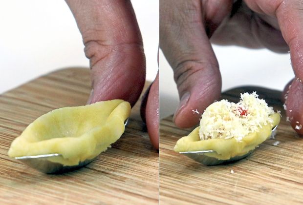 Press dough into the mould and insert another mould to make an cavity that can be filled with the coconut filling.