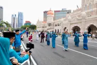 Families flock to revamped Sultan Abdul Samad Building to celebrate first day of Aidilfitri