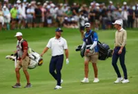 Golf-DeChambeau holds two-shot lead after third round in South Africa