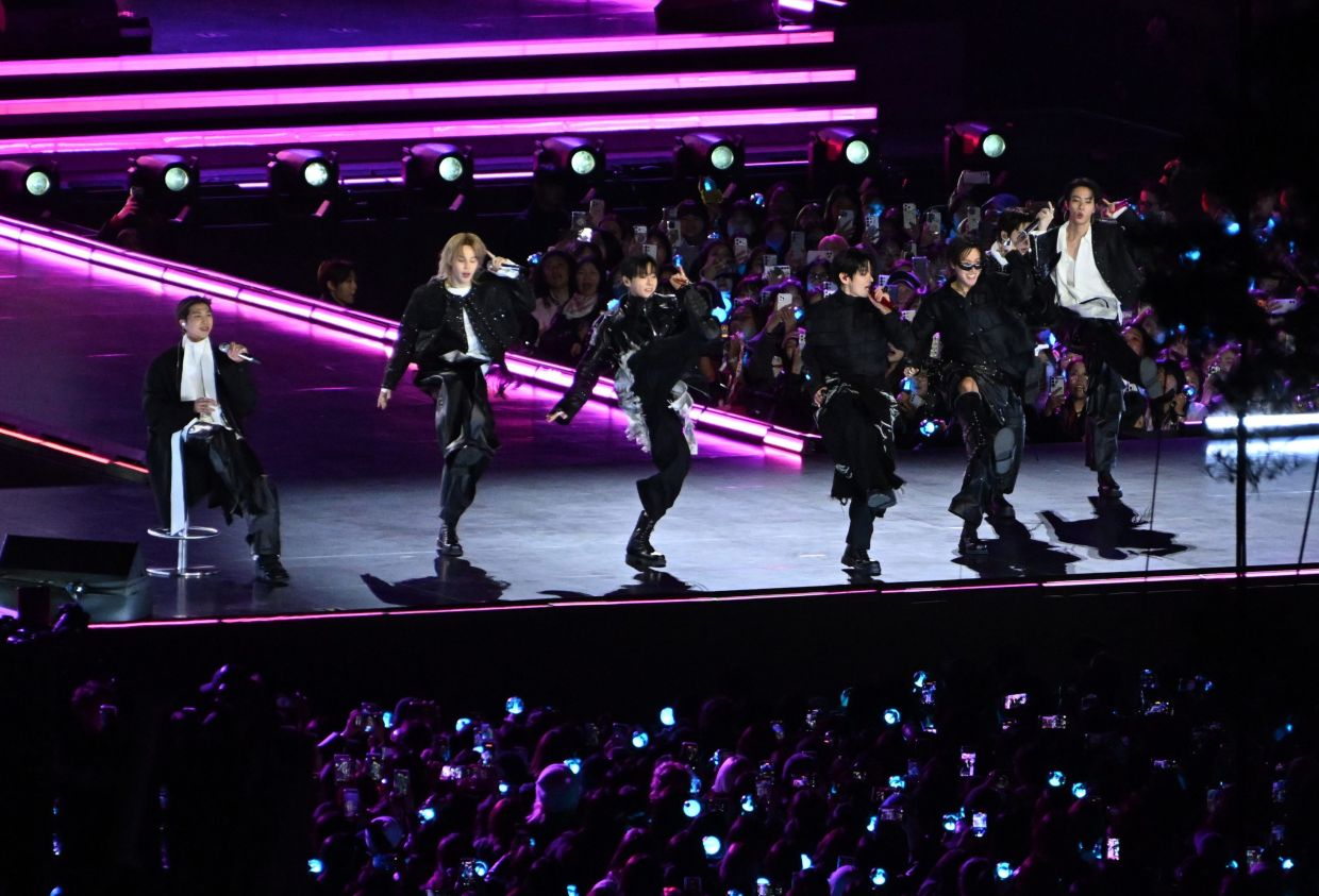 K-pop boy band BTS performs onstage during a comeback concert at Gwanghwamun Square in Seoul, South Korea. -- Photo: Kim Min-Hee/Pool Photo via AP