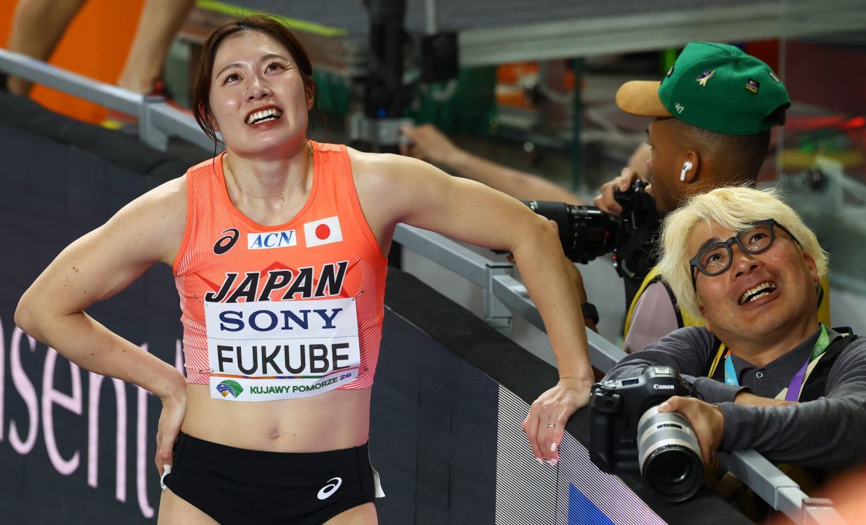 Athletics - World Indoor Championships - Kujawsko-Pomorska Arena, Torun, Poland - Sunday, March 22, 2026; Japan's Mako Fukube reacts after placing fourth in heat 6 of the women's 60m hurdles. -- Photo: REUTERS/Bernadett Szabo
