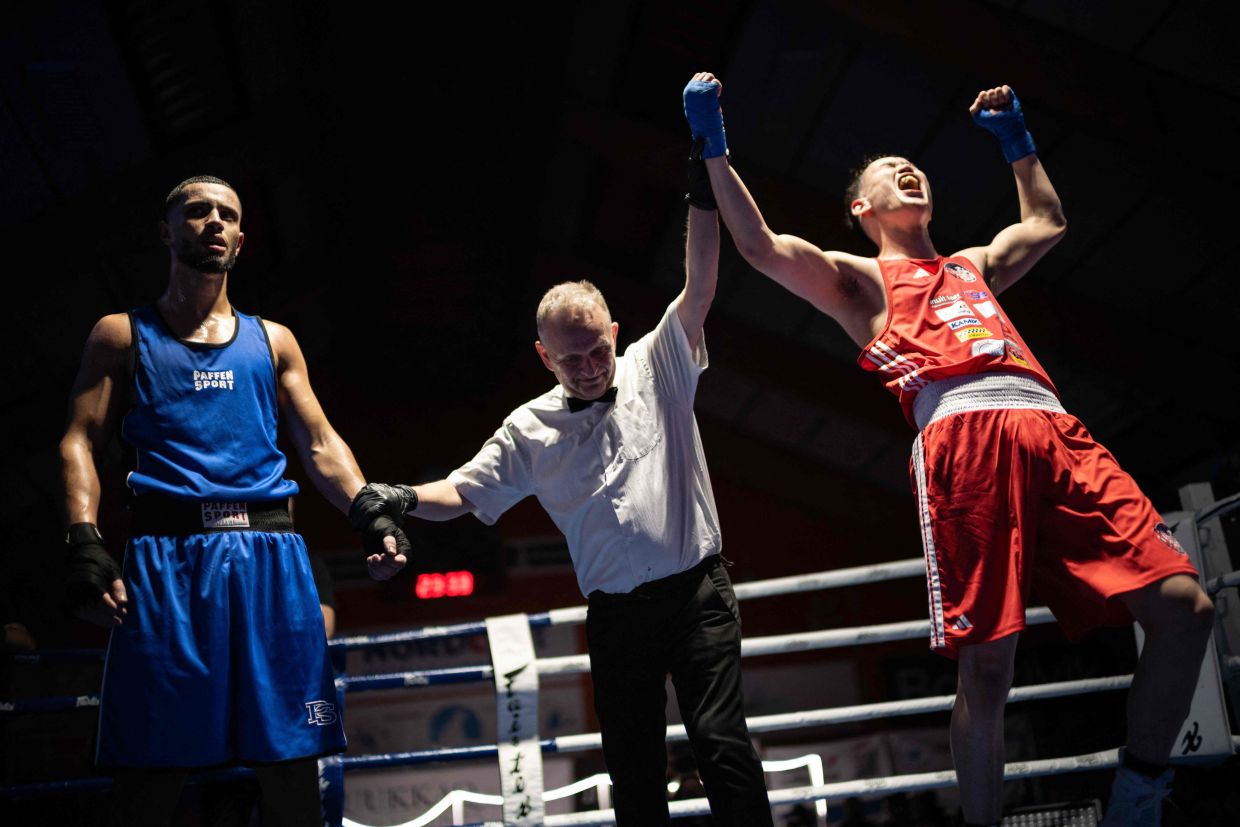 Nunu, a Greenlandic fighter, celebrates after being declared the winner against his Danish opponent during a 'Fight for Greenland' bout in Nuuk, Greenland, on February 28, 2026.