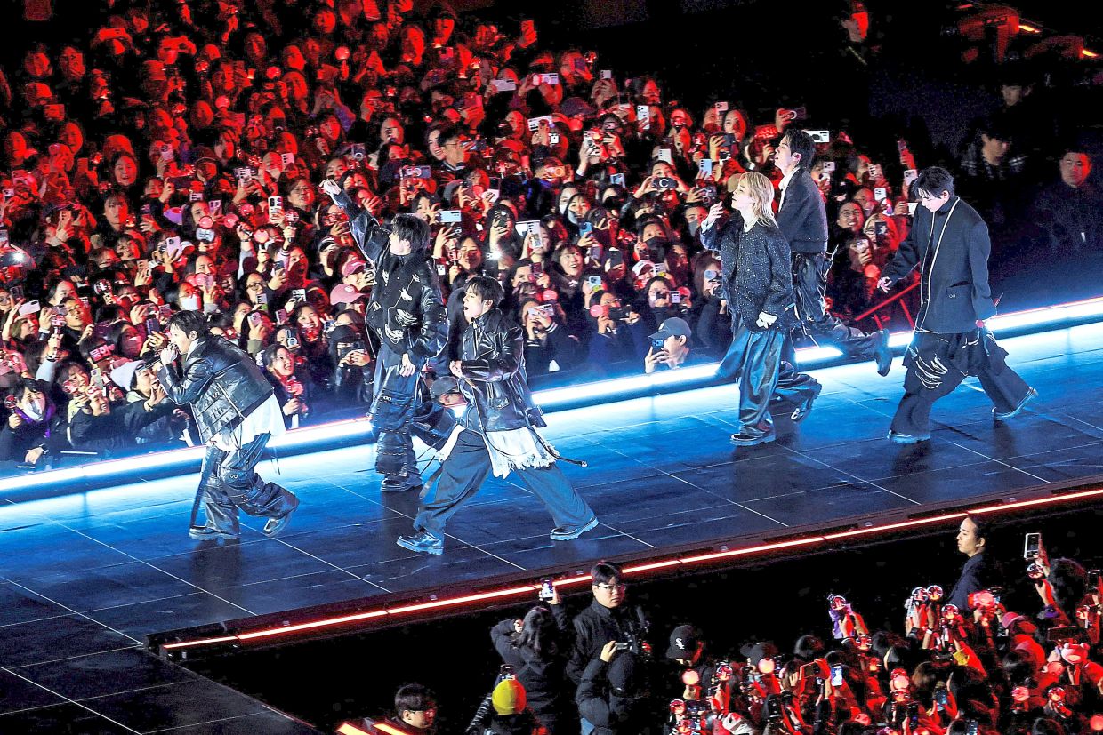 2. BTS firing up the crowd in their first concert in nearly four years. — Reuters