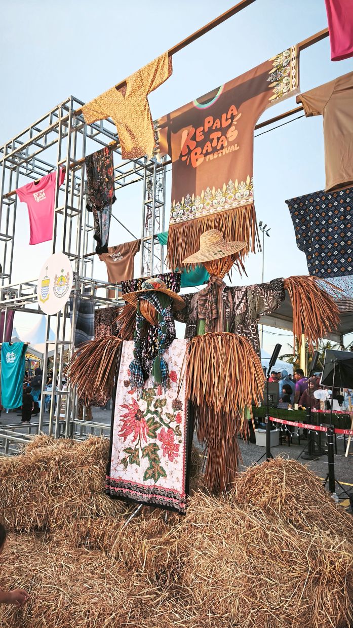 An art installation using straw, batik and clothing at the inaugural Kepala Batas Festival.