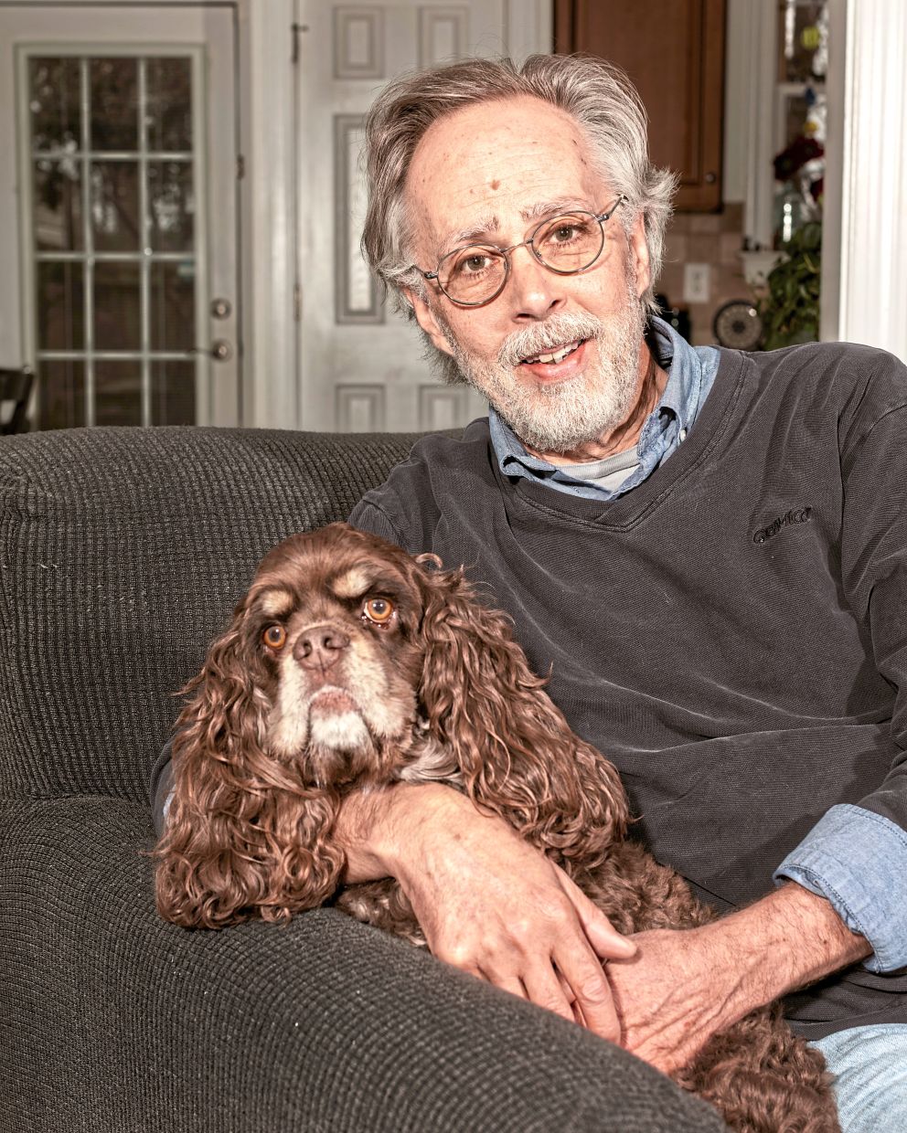 Paul Londraville bought an electric clipper that attaches to a vacuum cleaner to deal with the hair on his four-year-old cocker spaniel, Oliver. — JEREMY M. LANGE/The New York Times