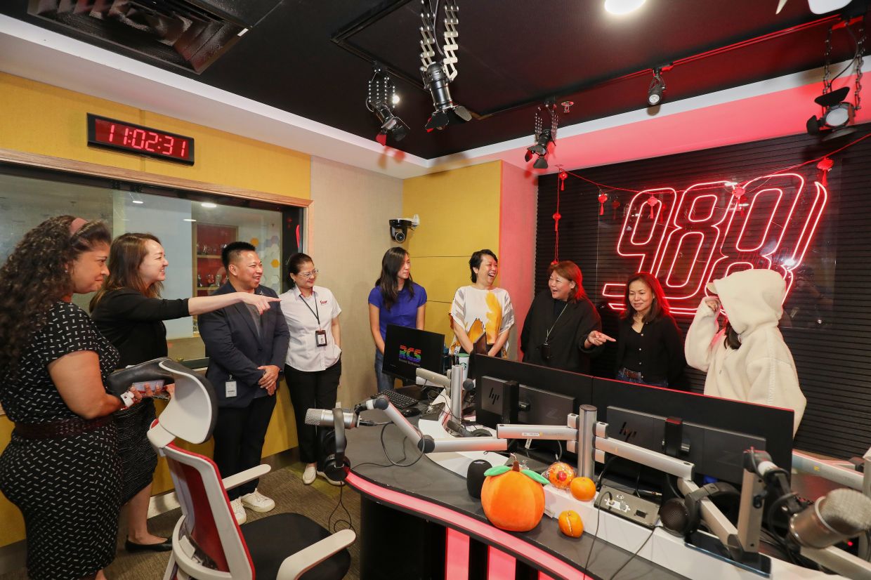 CelcomDigi representatives during a radio tour at 988fm’s radio station in Menara Star, Petaling Jaya.