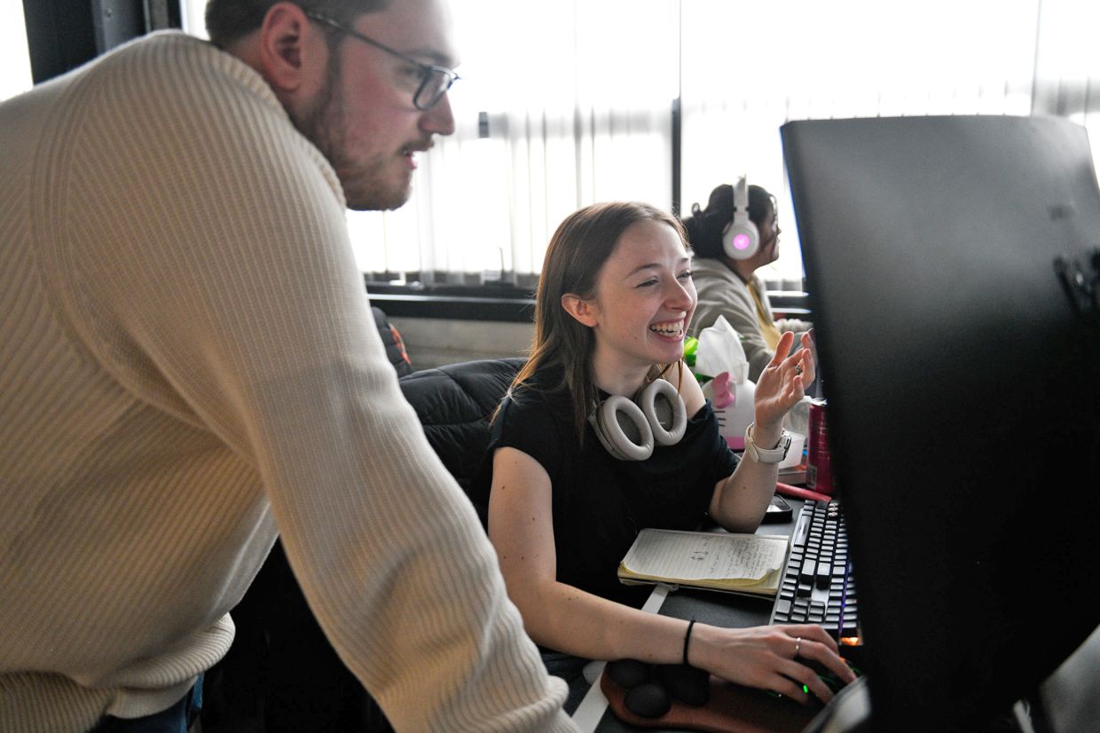 Makenzie Wolf, 21, a cinematic designer with Mega Cat Studios, works on the Polish Hill-based video game development company's latest project, God of War Sons of Sparta, which was recently released for Sony's PlayStation 5, on Feb. 24, 2026 in Pittsburgh. — Pittsburgh Post-Gazette/TNS