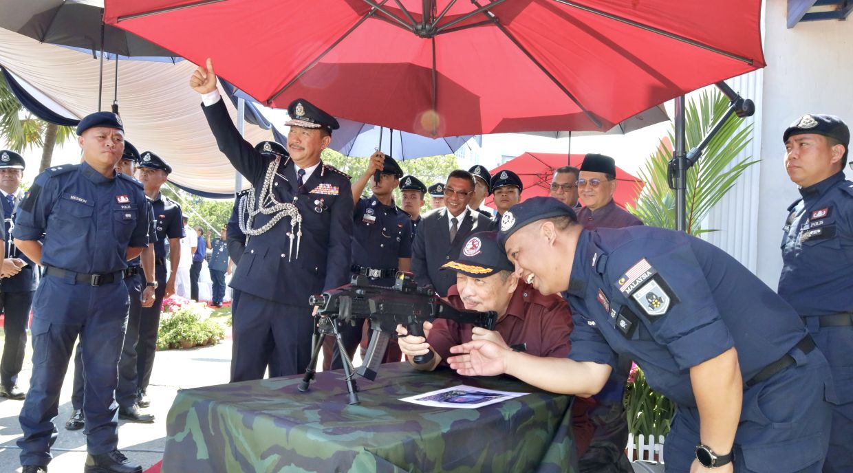 Chief Minister Datuk Seri Hajiji Noor accompanied by Sabah Police CommissionerDatuk Jauteh Dikun, views the exhibits at the Sabah Police Gallery.