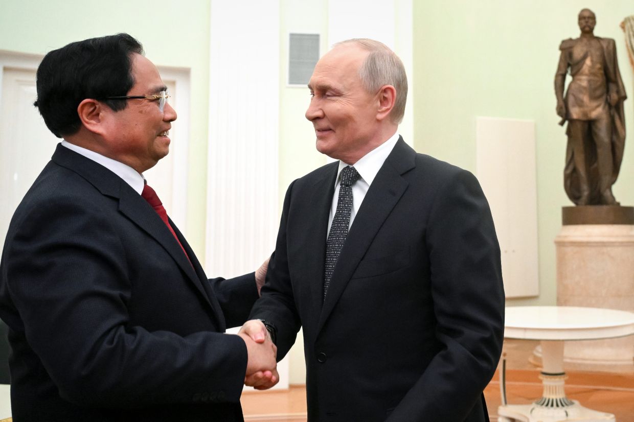 Russian President Vladimir Putin and Vietnamese Prime Minister Pham Minh Chinh during their meeting at the Kremlin in Moscow, Russia, on March 25, 2026. - AP