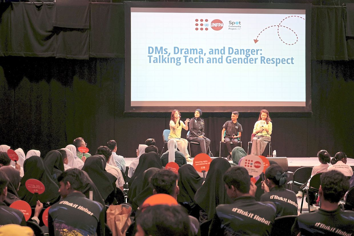 Malaika – a volunteer with Spot Community Project – moderates at a talk. Photo: Eena Houzyama
